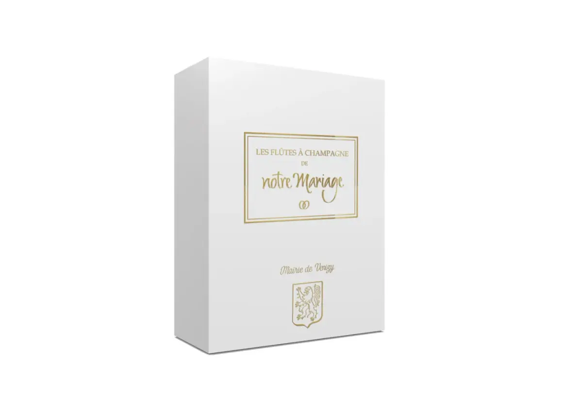 Boîte blanche pour des flûtes à champagne personnalisées mariage, avec inscription dorée "Les flûtes à champagne de notre mariage" et blason de la Mairie de Venizy.